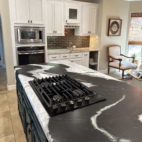 black and white marble countertops on a kitchen island